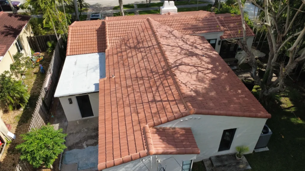 Close aerial view of tiled roof and backyard