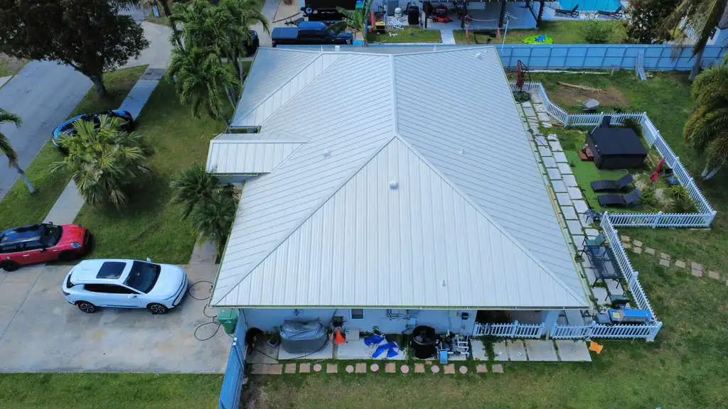 Aerial view of home with light gray metal roof