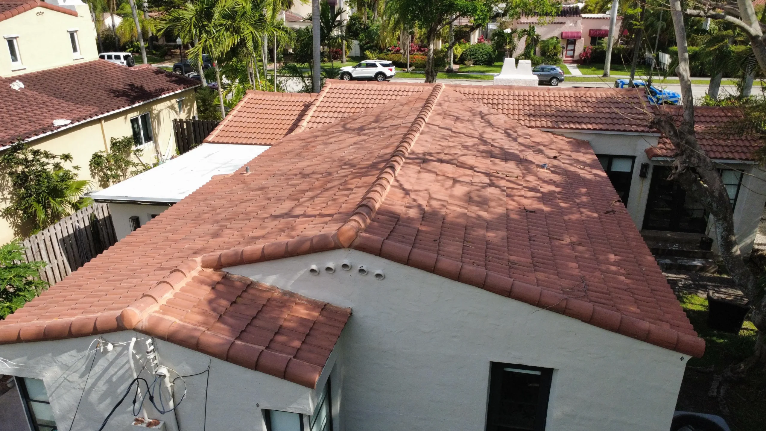 Angled aerial view of home roof and driveway