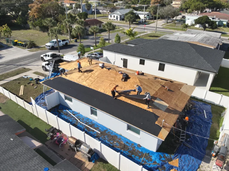 Underlayment installation during a shingle roof replacement in Miami, Florida