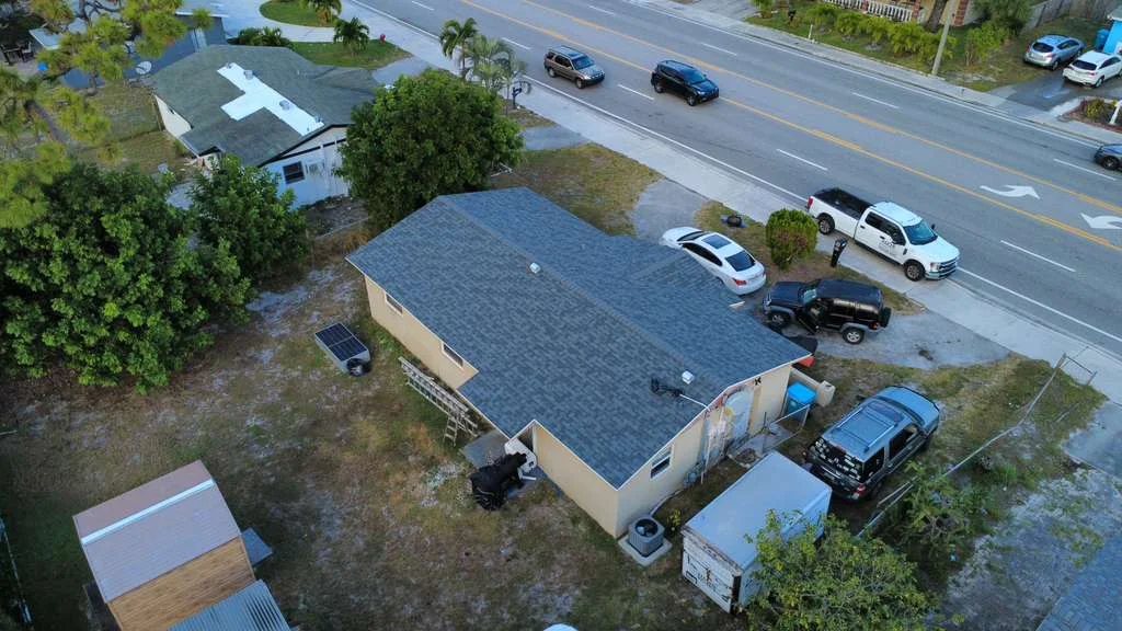 Aerial view of newly installed asphalt shingle roof