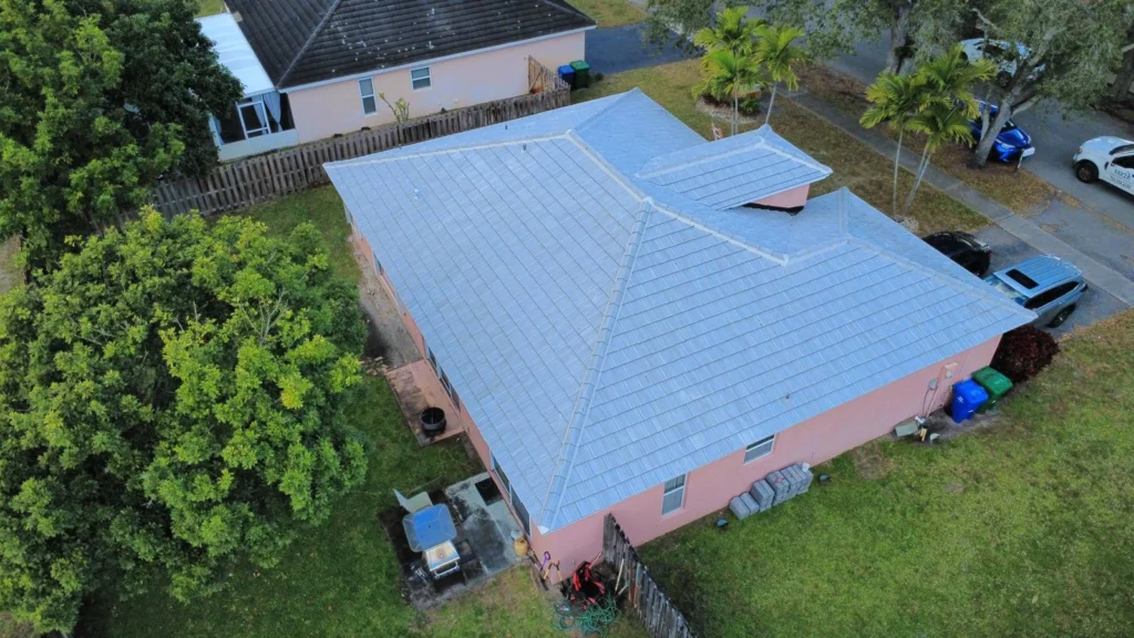Aerial perspective of home and adjacent properties with gray roof