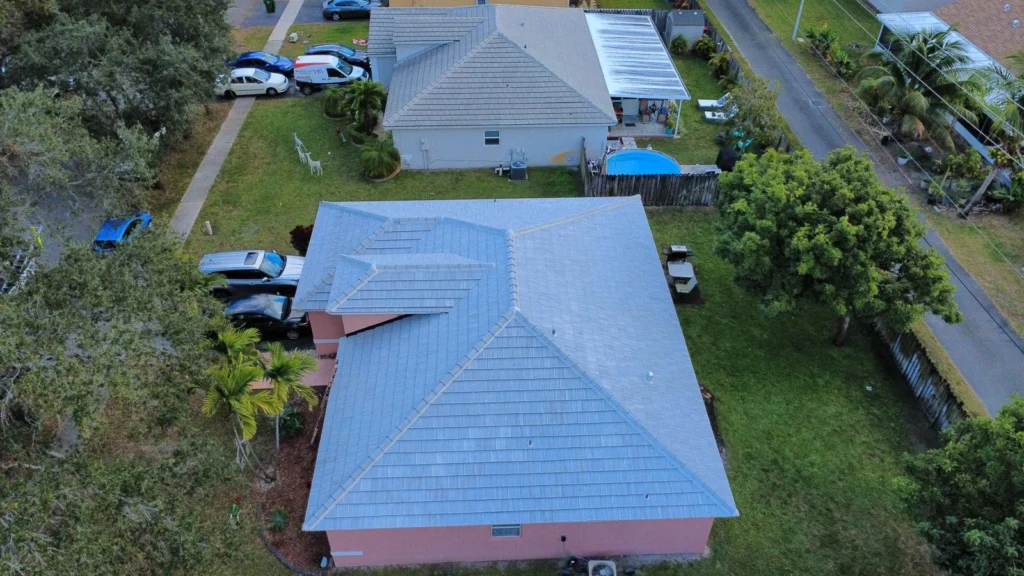 Aerial view of a single-story home with a newly installed gray roof