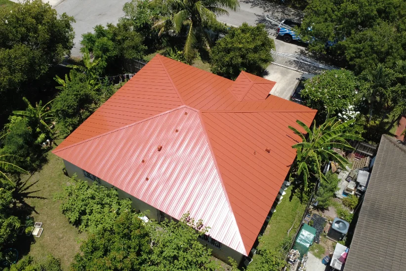 Aerial view of a Florida home with a new terracotta standing seam metal roof
