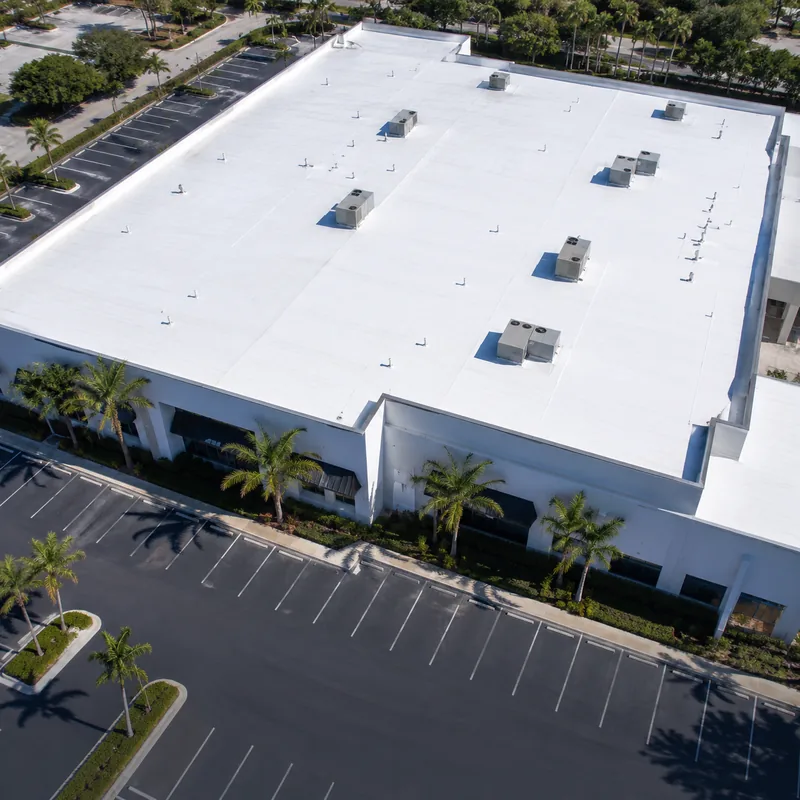 White commercial flat roof with rooftop HVAC units