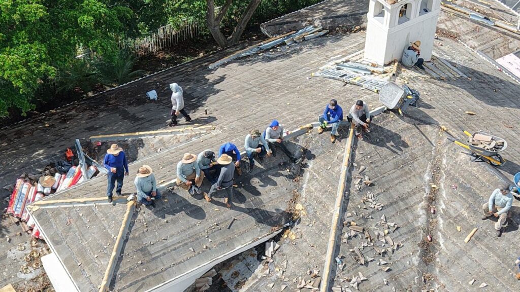 A Maze Roofing crew working together on a large roof replacement in South Florida A Maze Roofing crew working together on a large roof replacement in South Florida