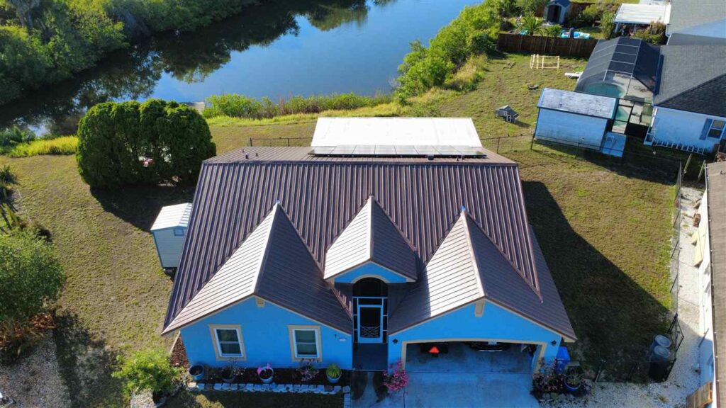 26-gauge exposed fasters metal roof in mill finish completed by Maze Roofing on a home in Apollo Beach, Florida 26-gauge exposed fasters metal roof in mill finish completed by Maze Roofing on a home in Apollo Beach, Florida