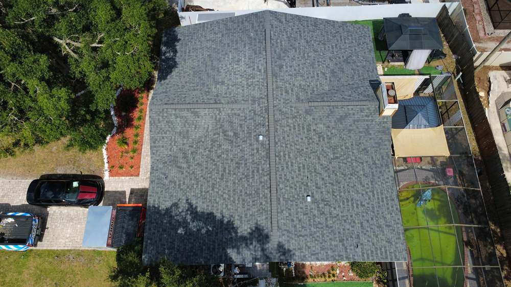 Aerial view of a completed Estate Gray shingle roof on a Tampa Bay home in Brandon Aerial view of a completed Estate Gray shingle roof on a Tampa Bay home in Brandon