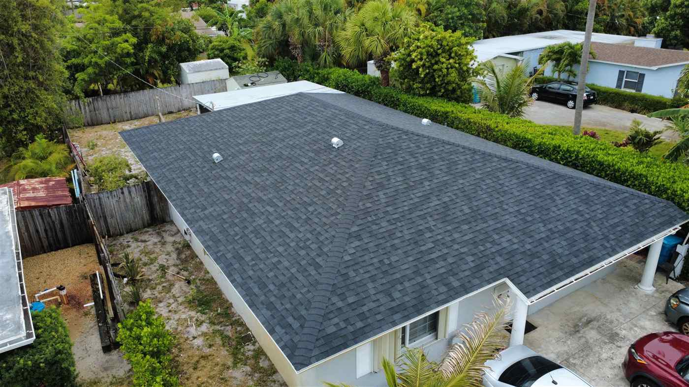Owens Corning shingle roof in Midnight Plum color completed by Maze Roofing on a home in Boynton Beach, Florida