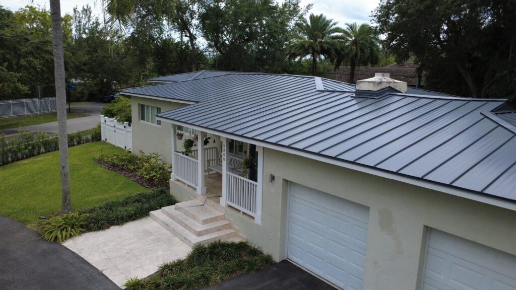 Completed standing seam metal roof replacement in South Miami, Florida by Maze Roofing, overhead view Completed standing seam metal roof replacement in South Miami, Florida by Maze Roofing, overhead view