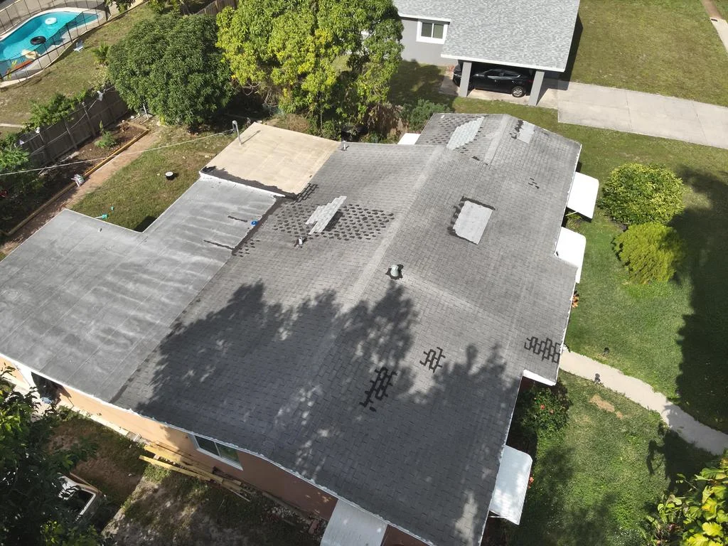 Aged Asphalt Shingle Roof Before Replacement