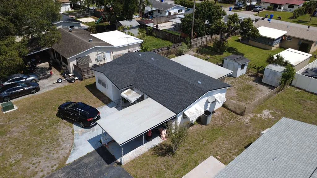 Black asphalt shingle roof aerial view