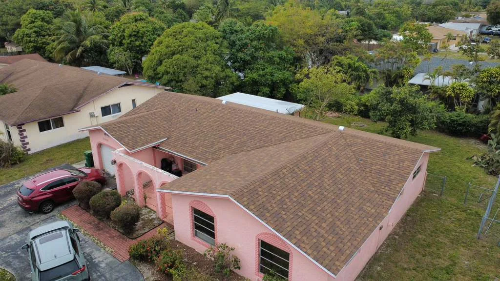 Brown asphalt roof replacement aerial view