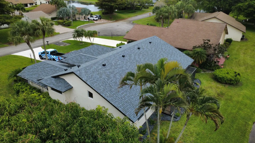 New blue shingle roof installation aerial view