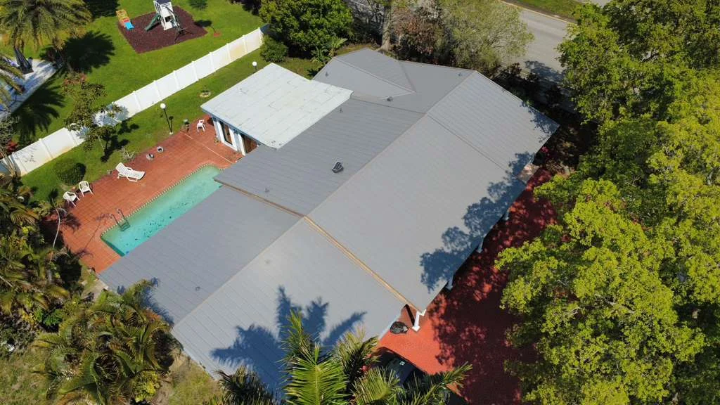 Residential metal roof above backyard pool