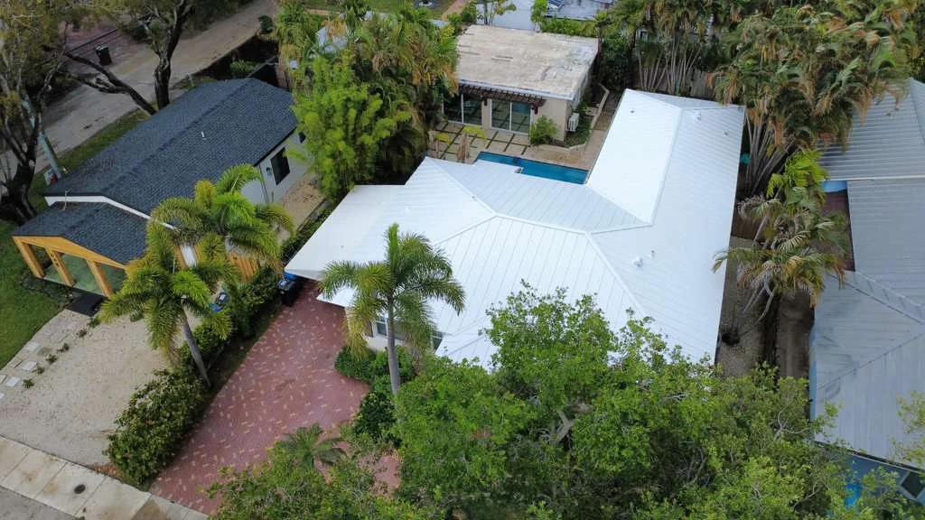 Home with white metal roof